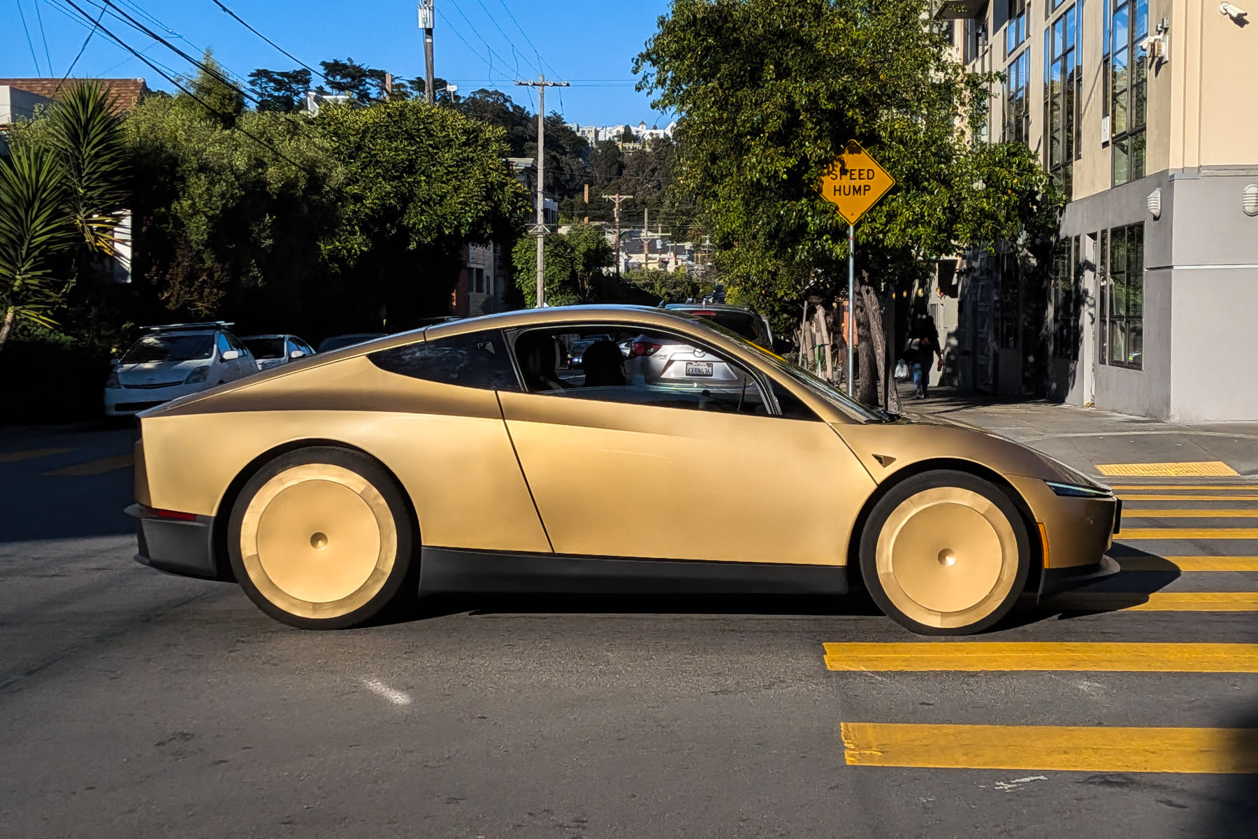 Gold Cybercab driving on a San Francisco street, June 2026